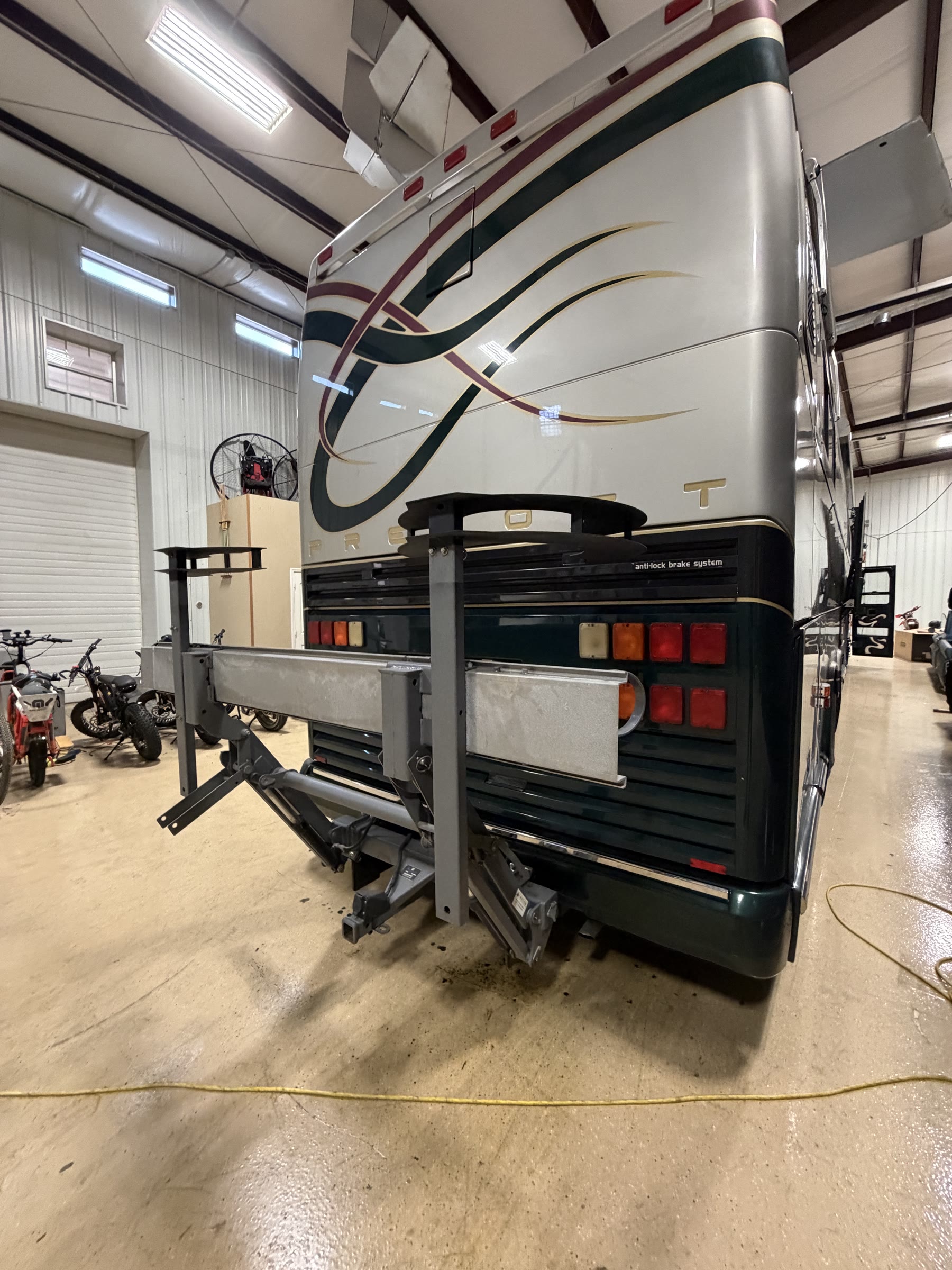Rear of Prevost coach with PREVOST lettering and cargo lift