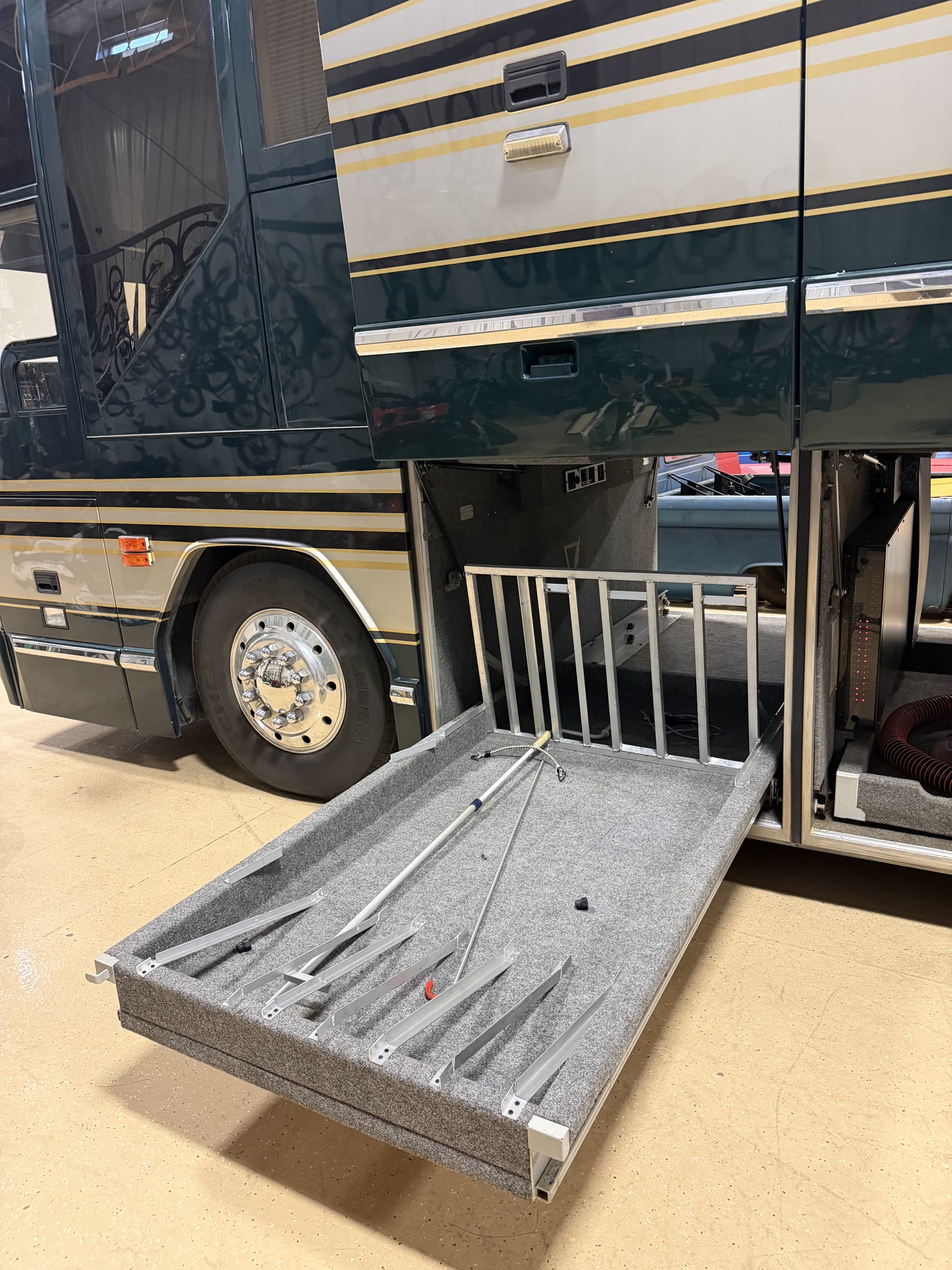 Carpeted basement bay with heavy-duty slide-out storage tray extended