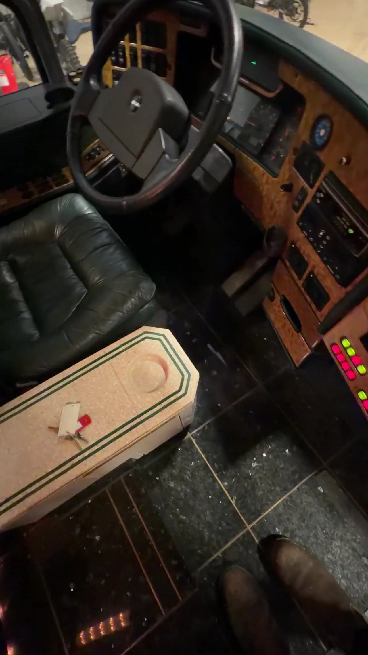 Driver cockpit with wood dash and leather seat