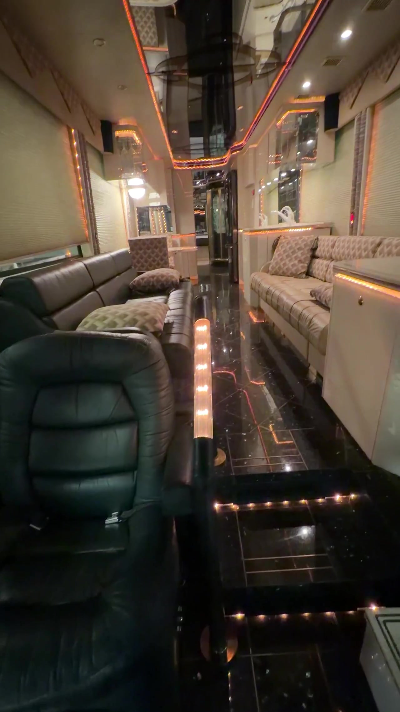 Luxury salon aisle with leather seating and LED accents
